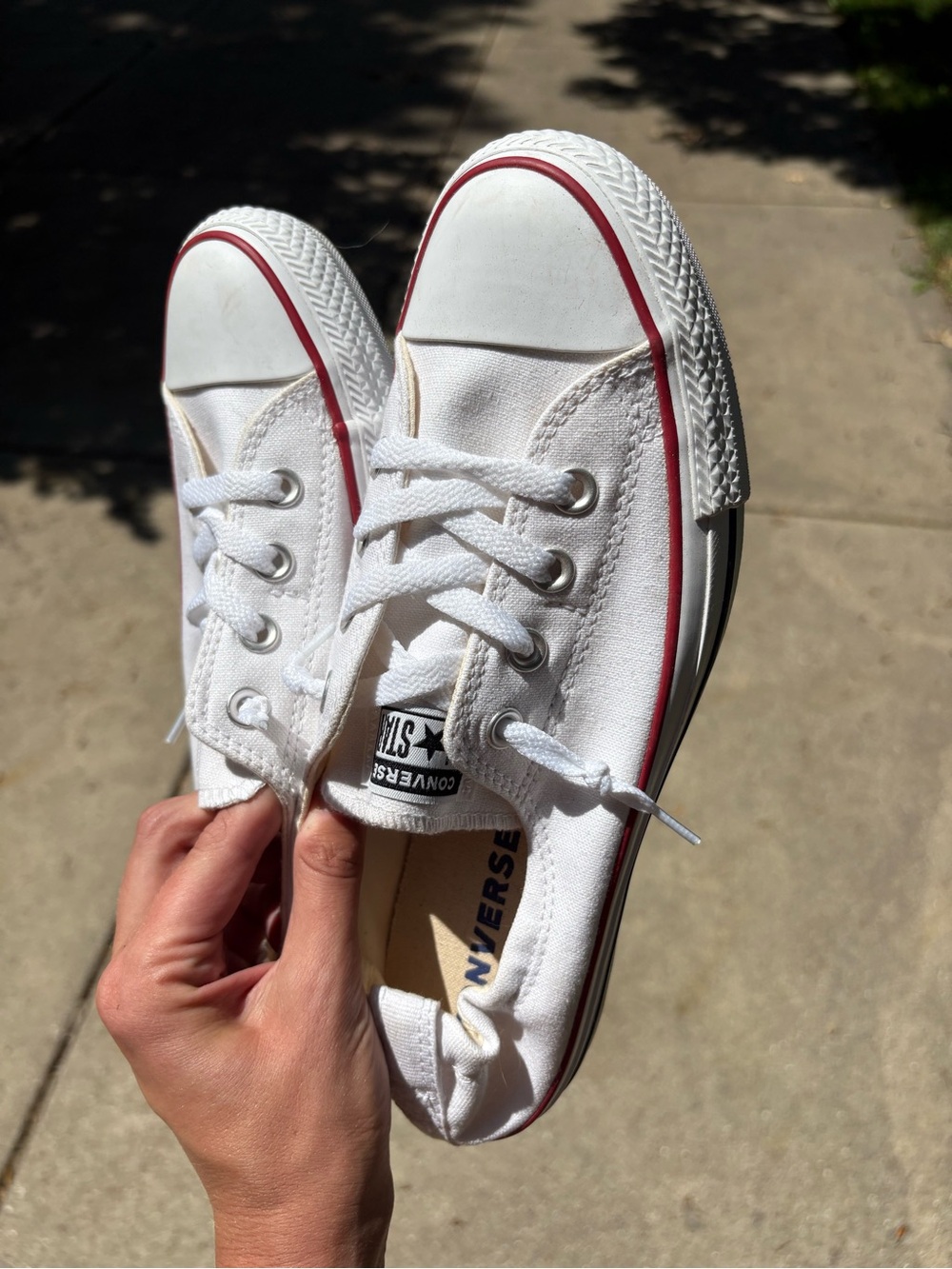 Converse Low Top Sneakers in White with Red Trim